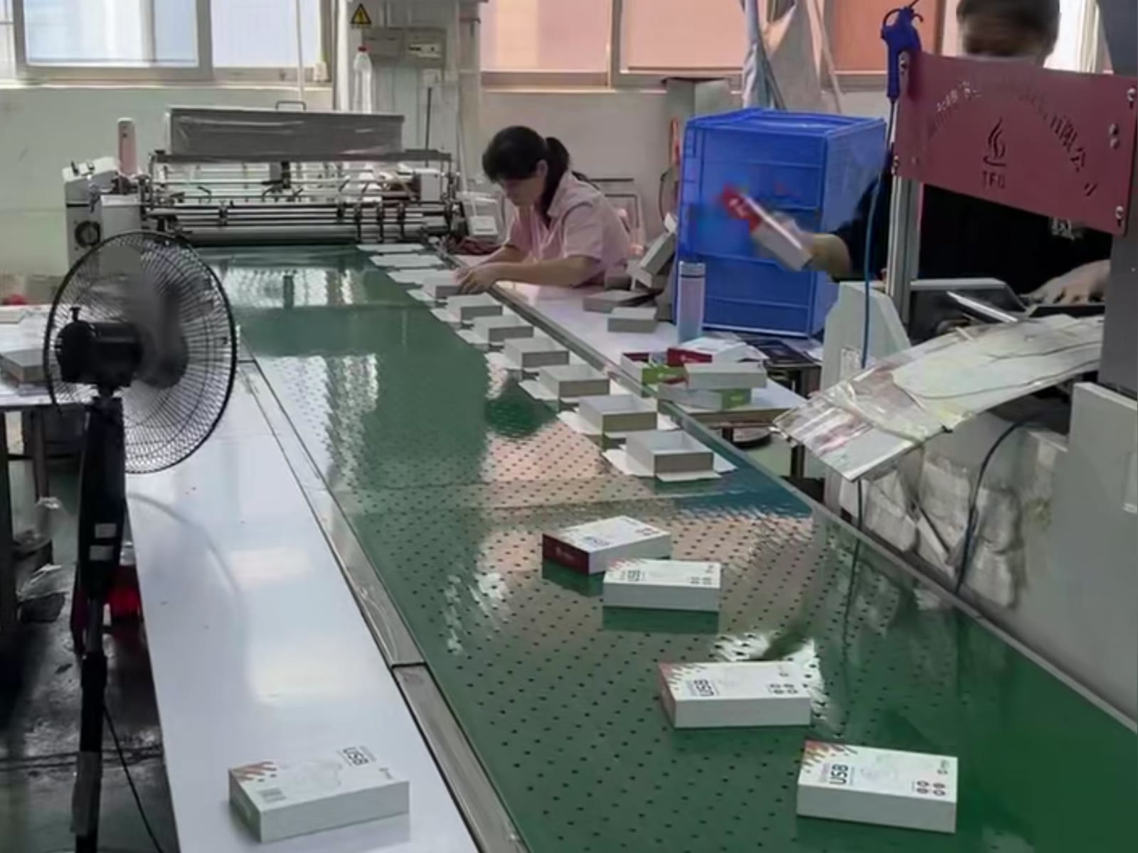 Why Choose Hibobestgift | Custom Paper Packaging Factory 8 Operators assembling printed paper boxes on the Hibobestgift production line
