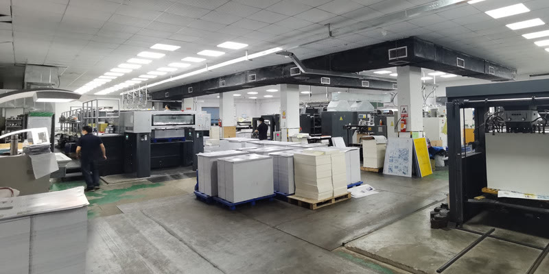 Why Choose Hibobestgift | Custom Paper Packaging Factory 11 Printing workshop at the Hibobestgift factory with presses and pallets of printed sheets waiting for the next process